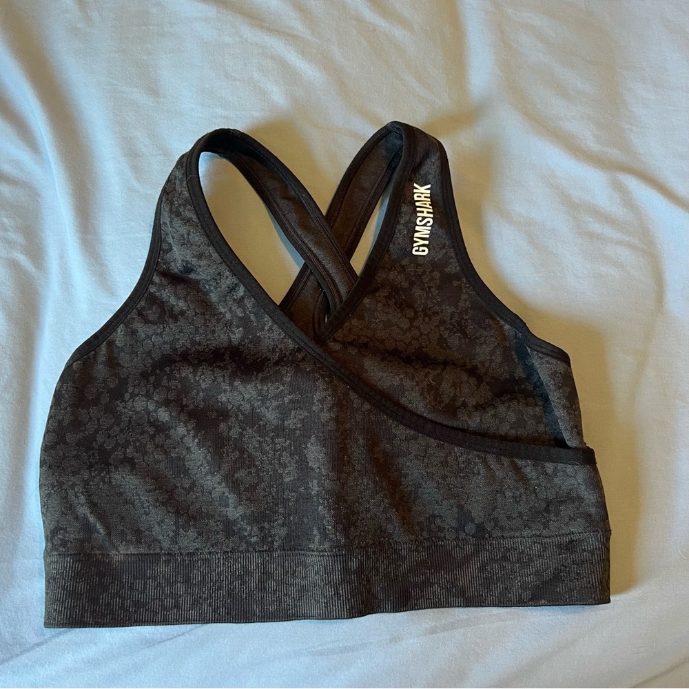 Gymshark black adapt animal sports bra, size large. In good condition.